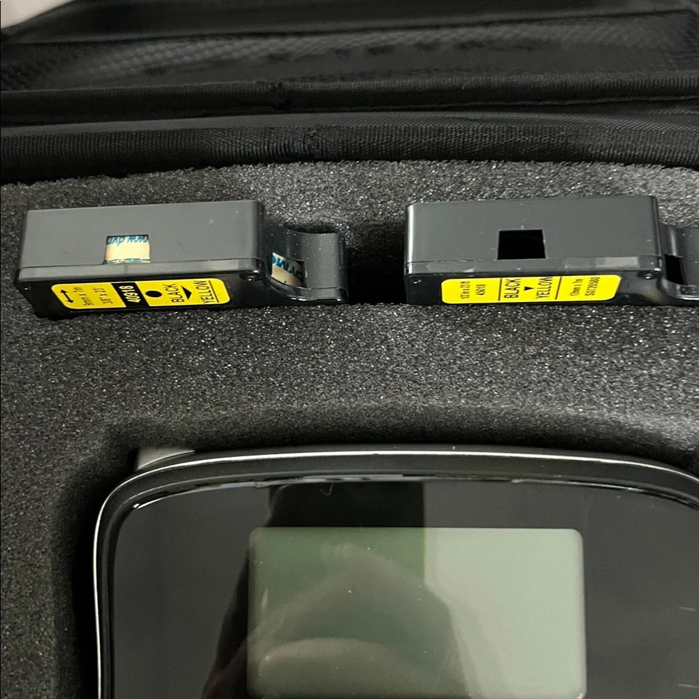 DYMO LabelManager 210D label maker with case and three label refills.